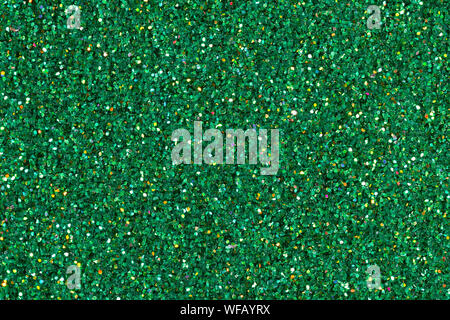 Green glitter con sfondo verde smeraldo. Alta qualità texture in una risoluzione estremamente elevata. Foto Stock