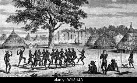 Il Bakers (Samuele e Firenze) guarda una danza di benvenuto. Sir Samuel White Baker (1821-1893) era un esploratore inglese. Nel marzo 1861 ha iniziato dopo il suo primo tour di esplorazione in Africa centrale. Egli fu il primo europeo a vista Lago Nyanza Albert, ora il Lago di Mobutu Sese Seko in Africa centrale e a scoprire che il fiume Nilo fatto fluire attraverso di essa. Egli ha anche fondato una colonia agricola in Sri Lanka. L'avventura africana - una storia dell'Africa esploratori da Timothy Severin, pagina 232. Foto Stock