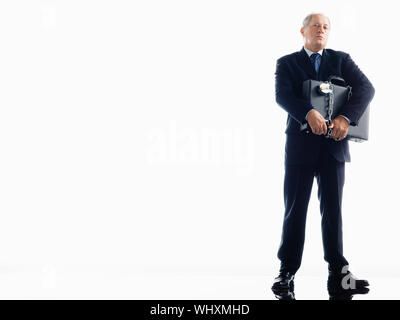 Imprenditore incatenati a valigetta Foto Stock