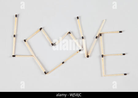 Words Love made of matchsticks isolated on white background Stock Photo