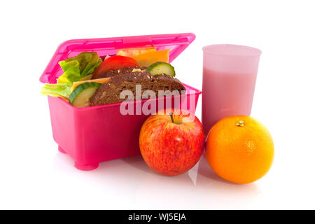 Lunchbox rosa con sani tutto pasto pane di frutta e latte Foto Stock