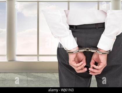 Immagine composita di chiudere fino a imprenditore di classe indossando le manette in 3D camera con enormi finestre Foto Stock