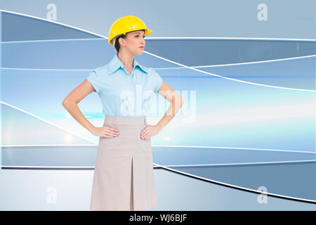 Immagine composita della grave architetto attraente in posa Foto Stock