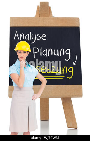 Immagine composita di pensosa attraente architetto in posa Foto Stock