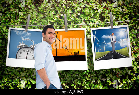 Immagine composita di sorridere casual uomo in piedi Foto Stock