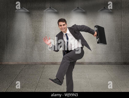 Immagine composita della sorridente imprenditore attraente in un hury Foto Stock