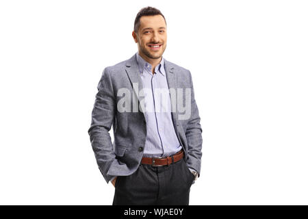 Giovane uomo elegante in posa con le mani nelle tasche isolati su sfondo bianco Foto Stock
