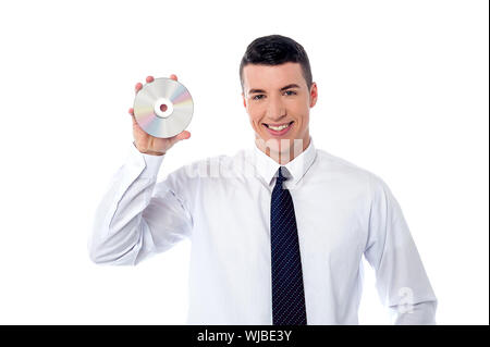 Smart executive tenendo un compact disc Foto Stock