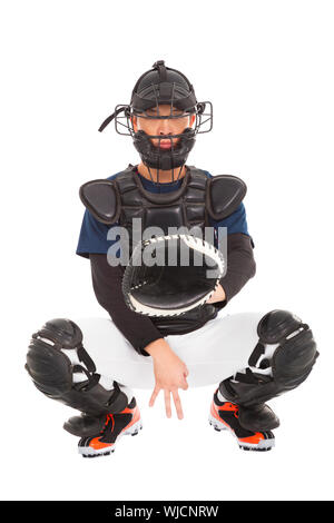 Giocatore di baseball , catcher mostra segnale segreto gesto Foto Stock