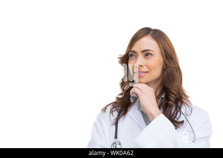 Riflessivo medico che guarda lontano Foto Stock
