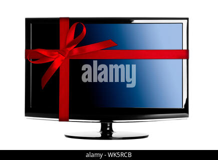 Moderno LED TV con un rosso Natale nastro Foto Stock