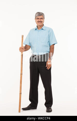 Man standing with his cane Stock Photo