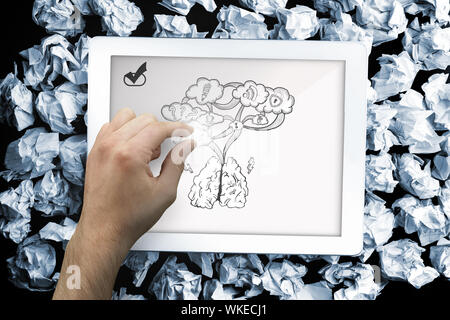 Immagine composita di mano toccando tablet che mostra il cloud computing doodle Foto Stock