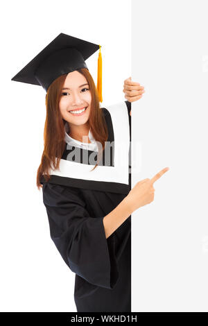 Giovane femmina la laurea studenti punto di blank board Foto Stock