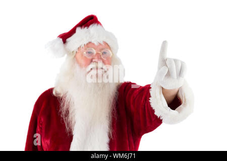 Santa Claus punti a qualcosa su sfondo bianco Foto Stock