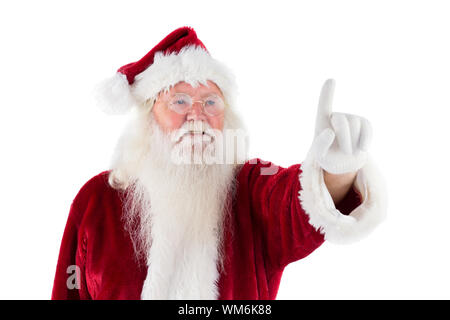 Santa Claus punti a qualcosa su sfondo bianco Foto Stock