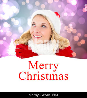 Felice festive bionda contro buon natale Foto Stock