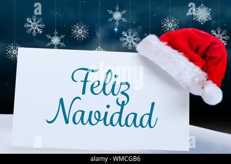 Feliz Navidad contro lo sfondo del fiocco di neve su pannelli del pavimento Foto Stock