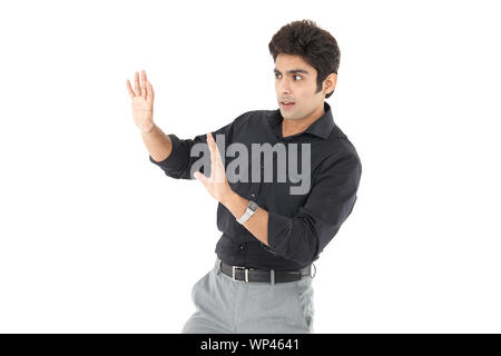 Businessman looking frightened Foto Stock