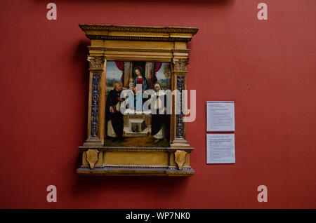 Garofalo, la Vergine () Madonna con il Bambino e i Santi Domenico e Caterina da Siena. 1499-1502 Foto Stock