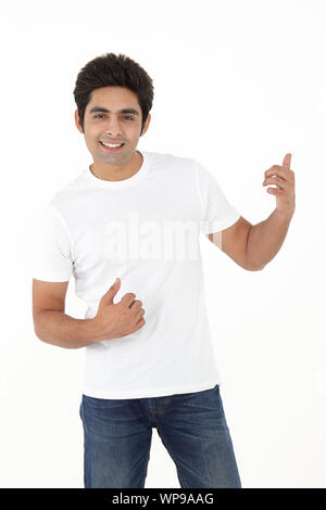 Young man pretending to play guitar Stock Photo