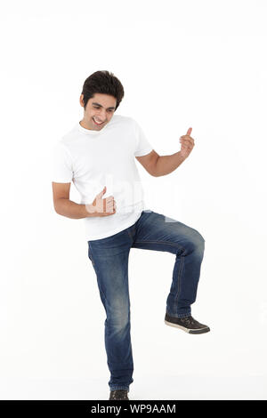 Young man pretending to play guitar Stock Photo
