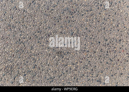 La texture di asfalto da grandi pietre di macerie Foto Stock