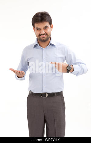 Young man pretending to hold something Stock Photo