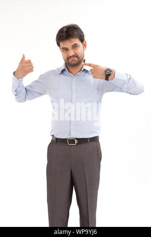 Young man pretending to hold something Stock Photo