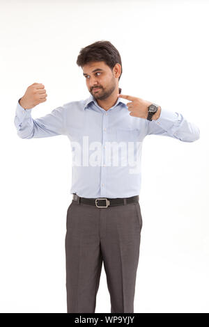 Young man pretending to hold something Stock Photo