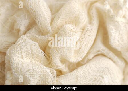 Colore avorio maglione a crochet. Texture Detail close up. Studio shot. Foto Stock