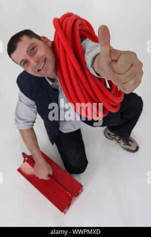 Elettricista dando il pollice in su Foto Stock