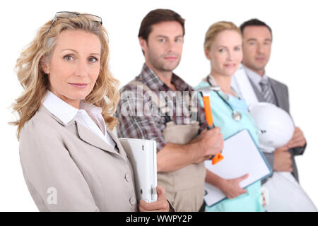 Vista di profilo di quattro professionisti provenienti da diversi domini Foto Stock