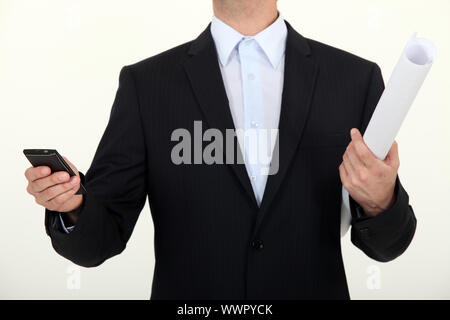 Manager in possesso di una carta Foto Stock