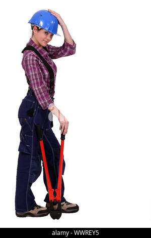 Donna con le pinze Foto Stock