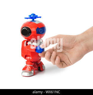 Handshake con robot giocattolo Foto Stock