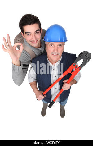 Builder e apprendista si presentò con frese a vite Foto Stock