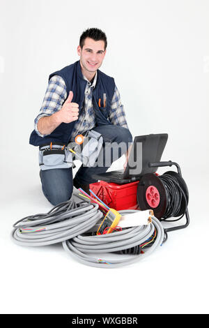 Elettricista dando il pollice fino Foto Stock