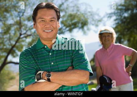 Giocatore di golf sorridente Foto Stock
