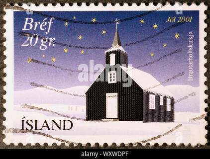 Chiesa in tempo di Natale su islandese francobollo Foto Stock