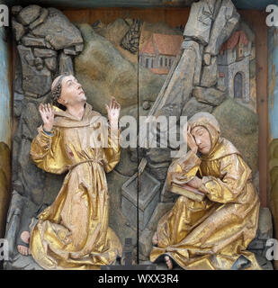 San Francesco di Assisi che riceve le stimmate. San Francesco altare nella chiesa francescana di Rothenburg ob der Tauber, Baviera, Germania Foto Stock